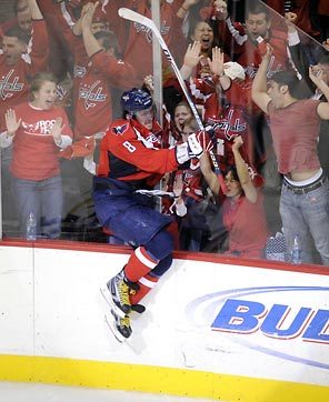 Back ... back ... back ... Ovechkin grabs it at the wall! What a catch!